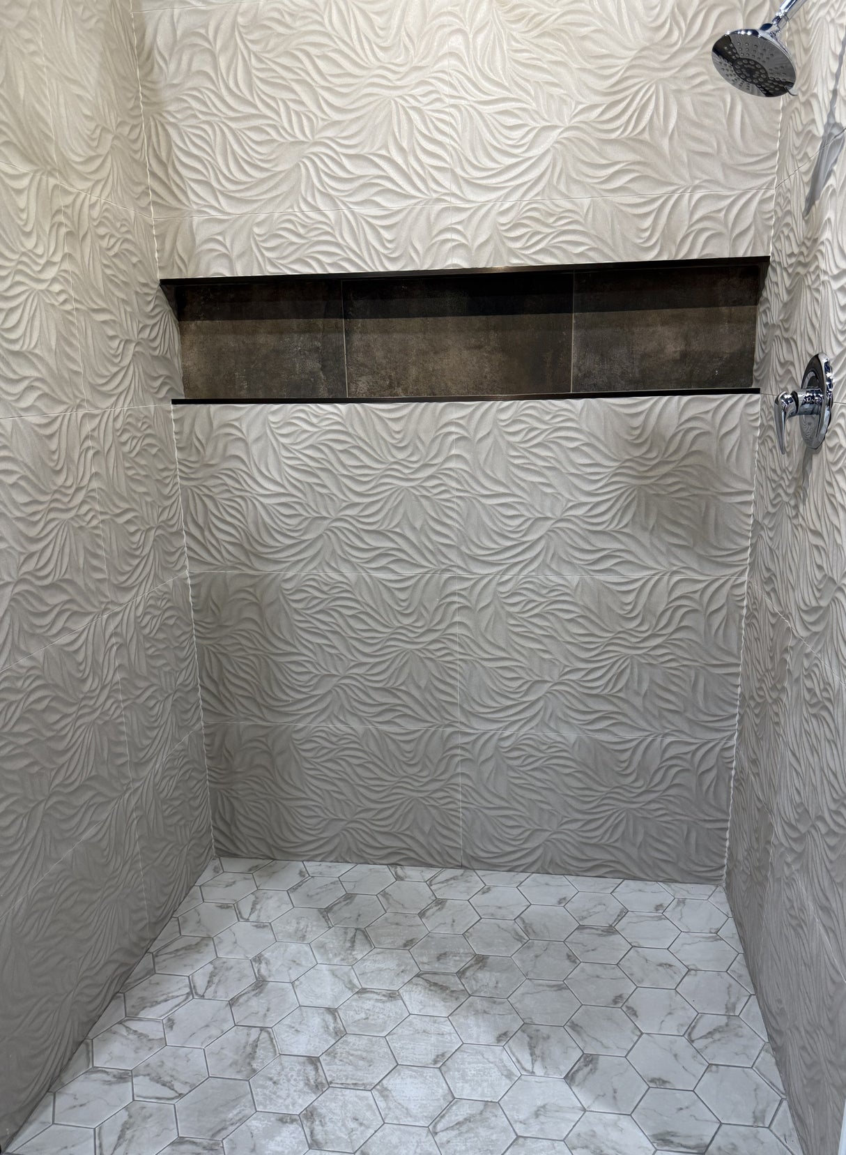 Tiled walk in shower with Calacatta Hex Glass Mosaic Tile floor