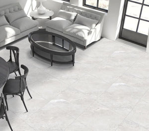 Living room with white tiled floor, gray sofa, and black coffee table.