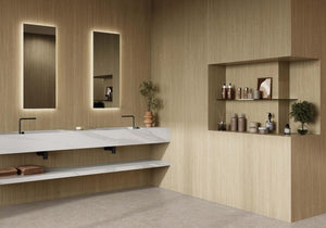 Modern bathroom with wood look porcelain wall tile, a sink, and shelves with decorative items.