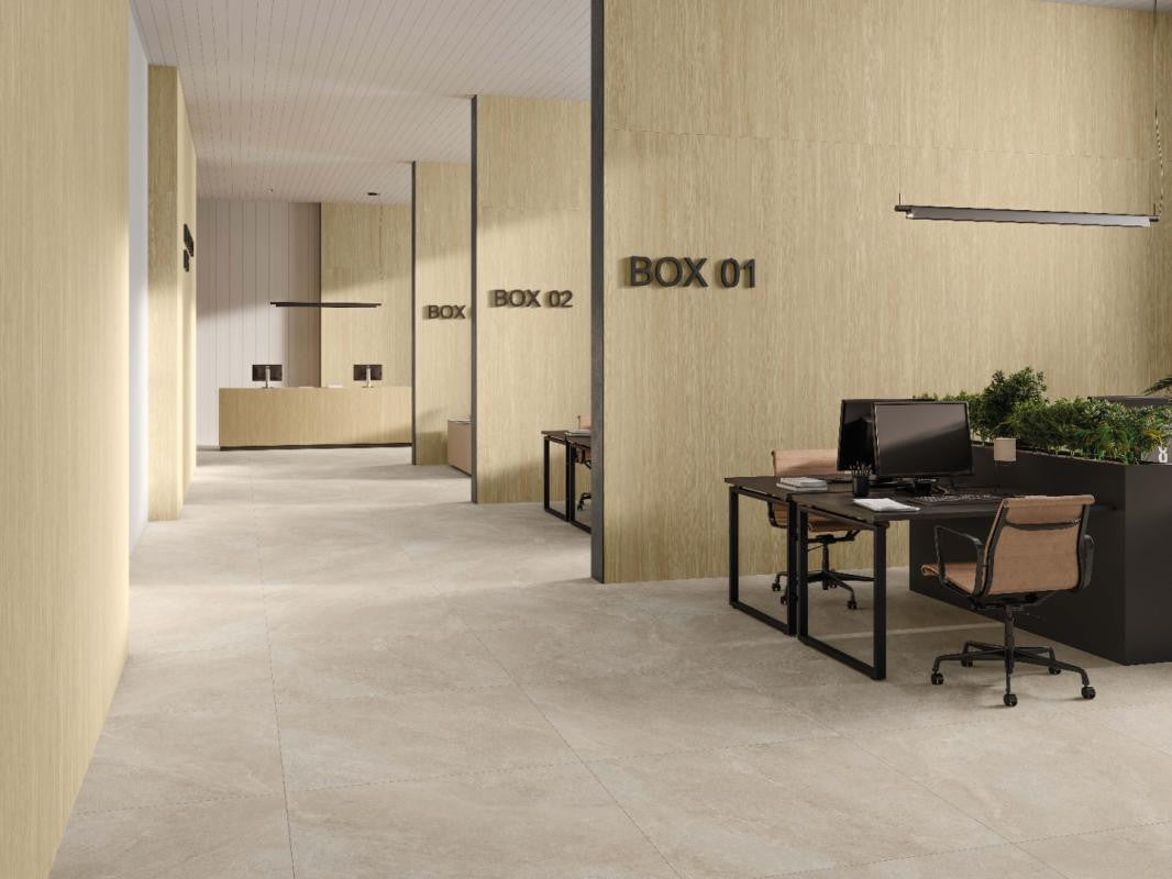 Modern office interior with desks featuring Spanish Porcelain Wood look tile on the walls.