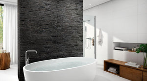 Modern bathroom with a freestanding bathtub, wooden shelf, and Thuy Marquina Porcelain Wall Tile