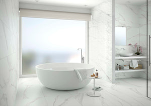 Updated bath with Spanish porcelain tile floor and freestanding tub.