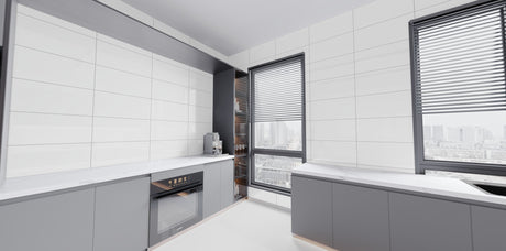 Pure White Polished 12x24 porcelain tile installed on kitchen walls above gray cabinets