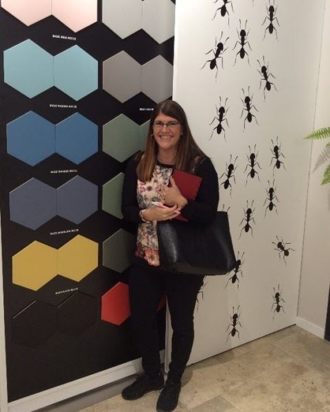 Here you see Kate in front of a hexagon color collection of Hexagon tiles from Codicer.