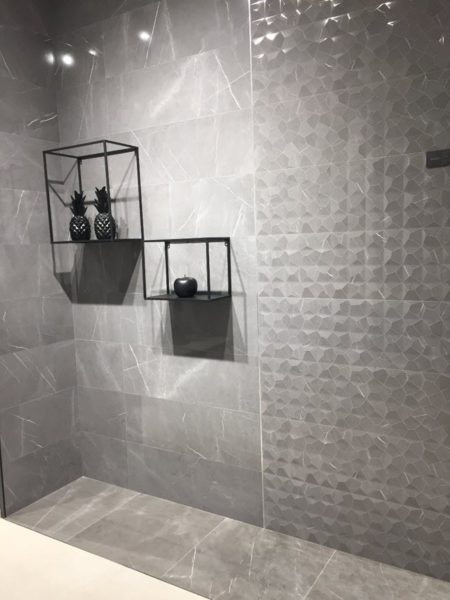 Try combining a 3D dimensional tile with a coordinating flat wall tile. 