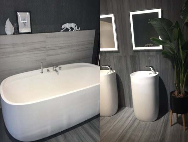 Look how beautifully the grey linear floor tiles highlight those behind the tub with the same look.